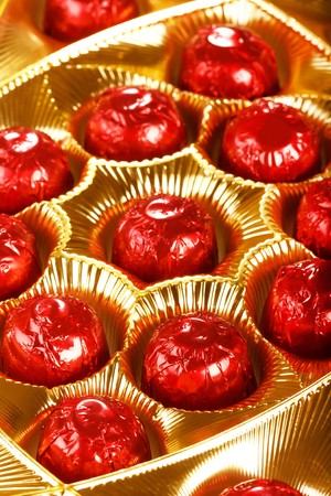 chocolate candy in red foil の写真素材
