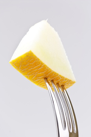 Galia melon on the fork の写真素材