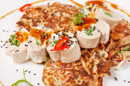 vegetable pancakes with chicken filletの写真素材