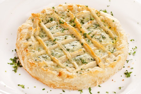 tasty quiche with cheese and herbsの写真素材