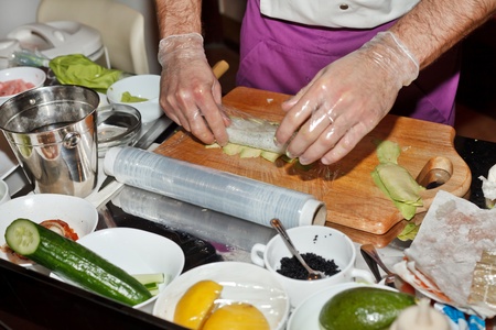 chef preparing sushi in the kitchen の写真素材