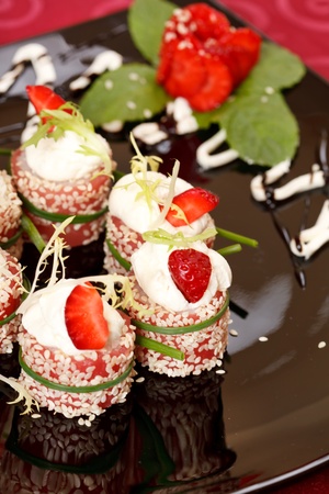 Tiramisu Sushi Roll garnished with Strawberry and Mint の写真素材