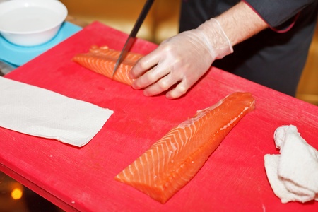 chef preparing sushi in the kitchen の写真素材