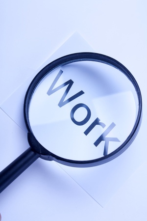 Magnifying glass and text "work"の写真素材