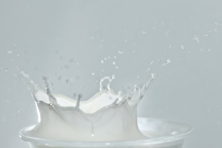 Splash in a milk glassの写真素材