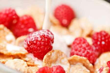 Cornflakes with milk and raspberries 
