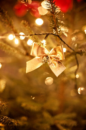 gold bow on the christmas tree