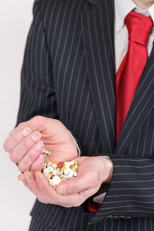 man holding pillsの写真素材