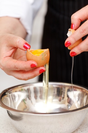 break an egg by dishの写真素材