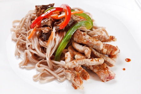meat with noodles and vegetables の写真素材