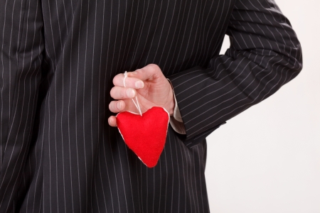 man with red heartの写真素材