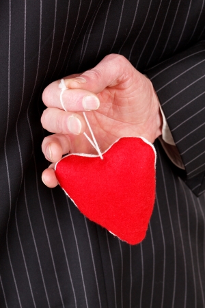 man with red heartの写真素材