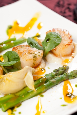 Baked scallops with asparagusの写真素材