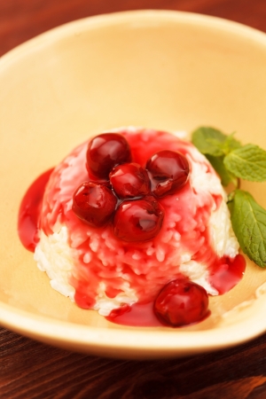 Rice pudding with cherryの写真素材