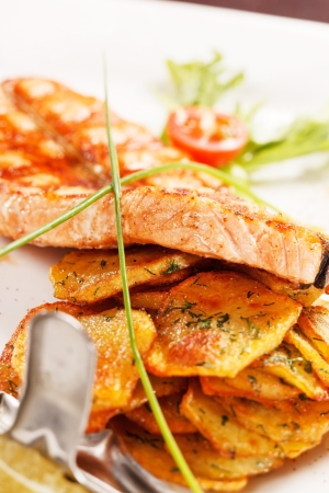 salmon steak with potatoesの写真素材