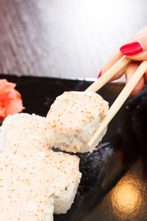 sushi with chopsticksの写真素材