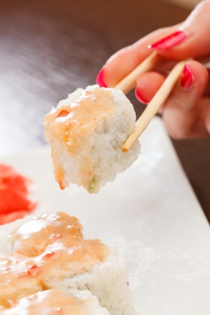 sushi with chopsticksの写真素材