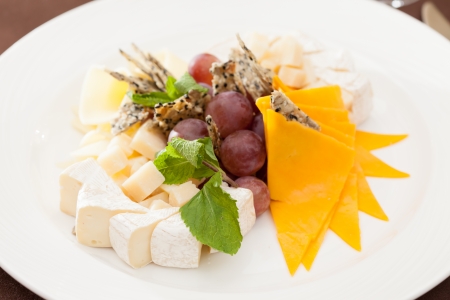 Cheese plate with grapesの写真素材
