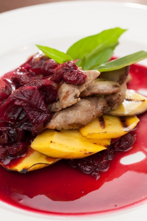 meat with mango and cherry sauceの写真素材