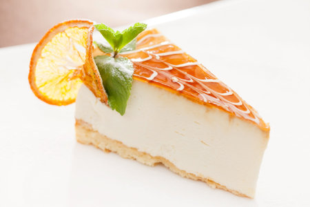 cheesecake with orange and mintの写真素材