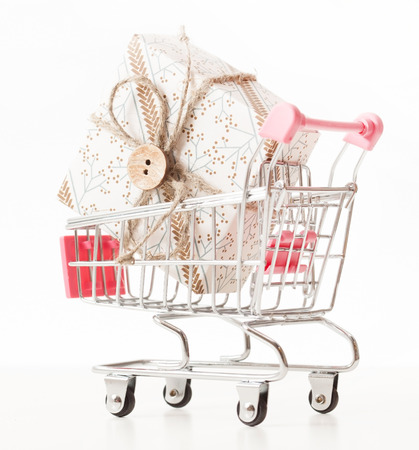 Christmas presents in shopping trolleyの写真素材