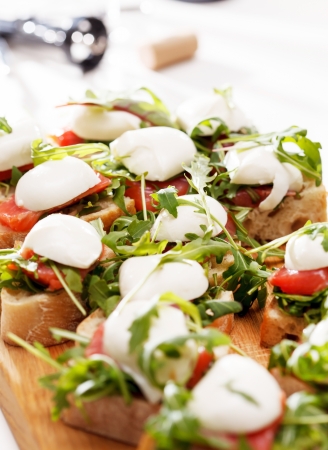 Tomato, mozzarella and arugula sandwichの写真素材