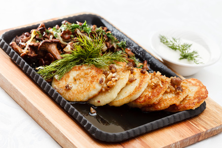 potato pancakes with mushroomsの写真素材