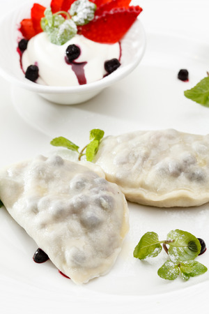 blueberry dumplings with sauceの写真素材