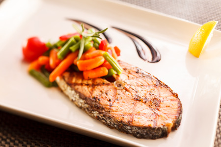 salmon steak with vegetablesの写真素材