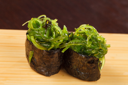 Japanese fresh maki sushi with chuka saladの写真素材
