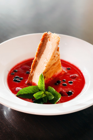 cheesecake with berry sauceの写真素材
