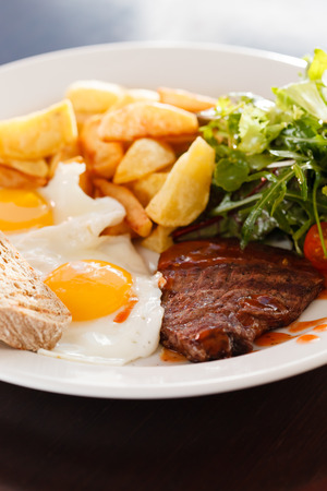 steak with eggs and vegetablesの写真素材