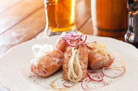 pork sausages with onionの写真素材