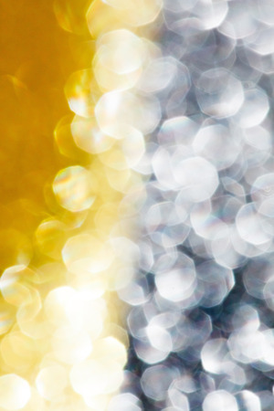 Abstract holidays golden lights on backgroundの写真素材