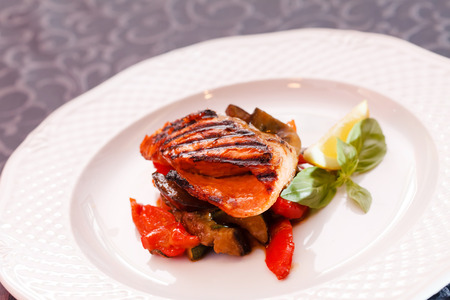 salmon steak with vegetablesの写真素材