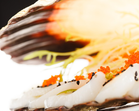 scallops presented on a scallop shellの写真素材