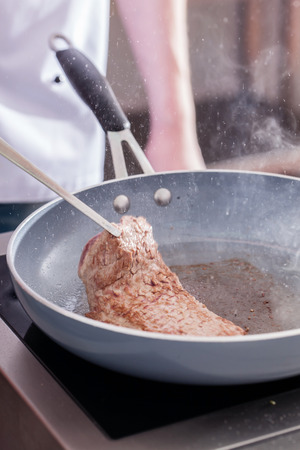chef making steakの写真素材