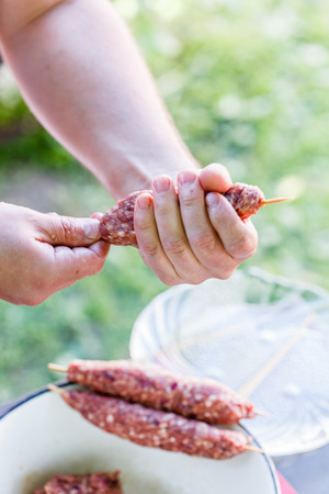 chef making kebabsの写真素材