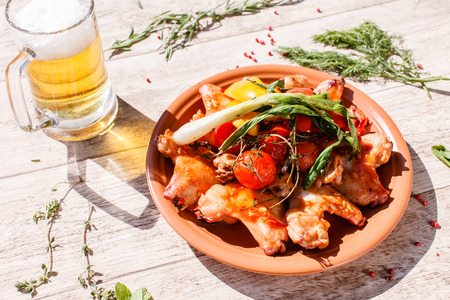 grilled chicken wings with vegetablesの写真素材