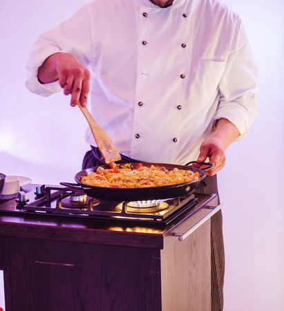 chef making paellaの写真素材