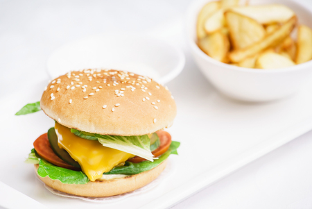 cheeseburger with potatoの写真素材