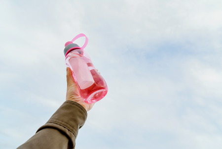 Female holding bottle of waterの写真素材