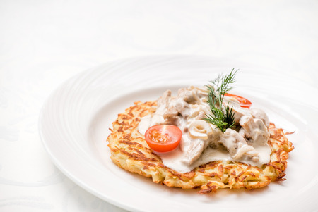potato pancakes with mushroomsの写真素材