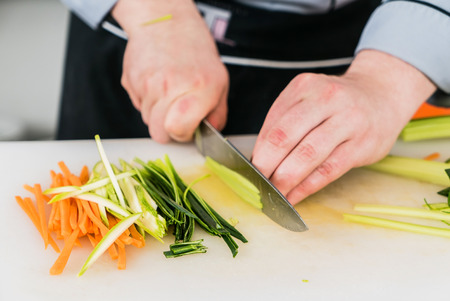 chef cutting vegetablesの写真素材