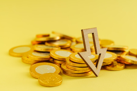 Euro coins with down trend arrowの写真素材