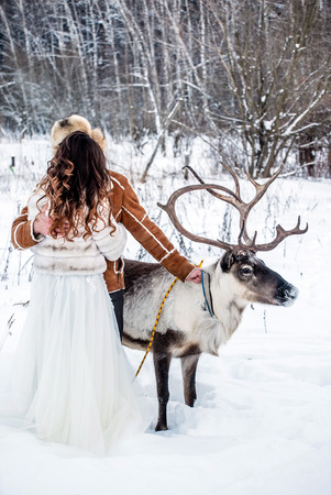 deer near bride and groomの写真素材