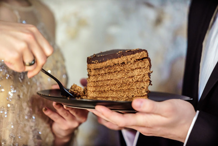 Bride and Groom  with wedding cakeの写真素材