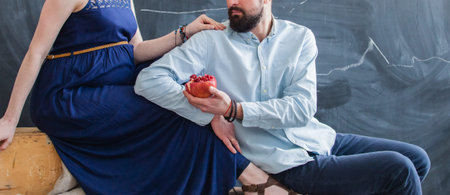 Man embraces his pregnant womanの写真素材