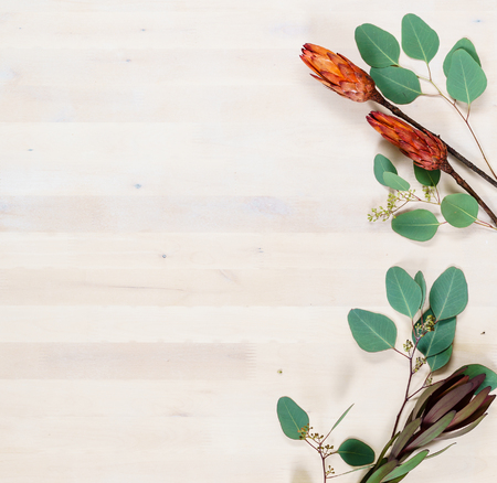 wooden board with leavesの写真素材