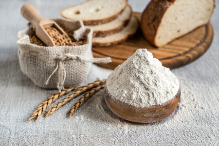 wheat and flour on the tableの写真素材